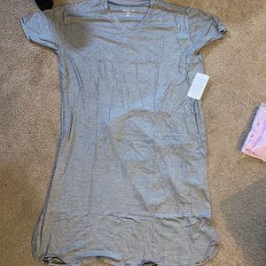 Black and white stripe long shirt and is short sleeved. Very soft